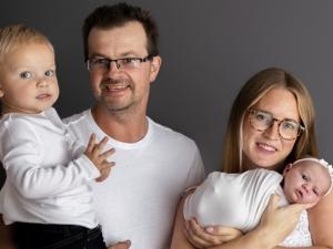 Joel and Raesha Enns with their two children.