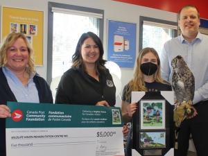 The Canada Post Foundation presents a cheque to the Wildlife Haven Rehabilitation Centre.