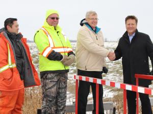 Last November, two provincial employees along with Deputy Mayor John Funk and MLA Ron Schuler meet outside Niverville.