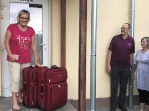 Dorothy Born at the Bodrog school, her large suitcases filled with toques and school supplies for the students. To the right: Laci Demeter, European Regional Director of ACSI, and school principal Marti Dan.