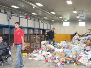 Workers at the SMILE of St. Malo Inc. recycling depot.