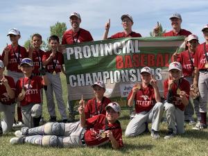 Back row: Mason Dearborn, Kennedy Morissette, Carter Fast, Seth Bunn, Jason Bunn (coach), Clayton Smeltz (coach), Stan Hiebert (coach), Niko Lemoine, and Seth Hooper. Front row: Noah Hudson, Cruze Janz, Jeremiah Martens, Tristan Cousineau, Ben Hiebert, and Ryan Smeltz.