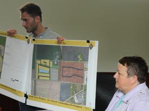 Jackie Wilkie and an associate of McGowan Russel Group present their conceptual drawings to council.