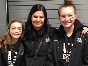 Carly Loeppky, Coach Mel Hall, and Brianna Ginter.