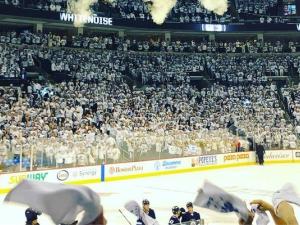 Fans celebrate a Jets victory at Bell MTS Place in Winnipeg.