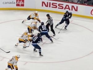 Scheifele takes a faceoff.