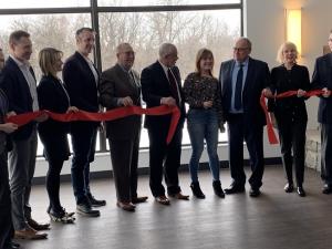 Officials gather to mark the opening of Muriel Taylor Hall.