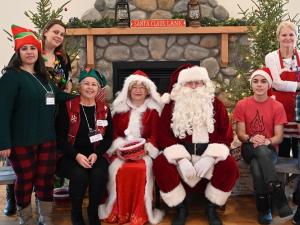 Volunteers for Christmas Town, with Mr. and Mrs. Claus.