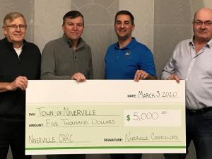 Councillor John Funk, Mayor Myron Dyck, Councillor Nathan Dueck, and Councillor Kevin Stott present their personal CRRC donation. Missing: Councillor Chris Wiebe.