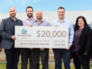 Tourond Creek presents cheque to the St. Adolphe Childcare Centre.