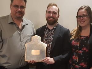 John Magri with Dylan Wiens and Amanda Wiens, accepting the award for Business of the Year.