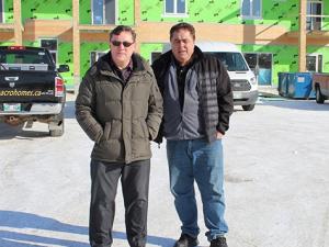 Dr. Phillip Hughes and Arthur Adam outside the new IDC Professional Centre
