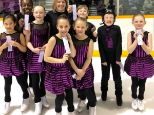 Niverville Skating Club’s synchro team, Aurora Ice, with their silver ribbons.