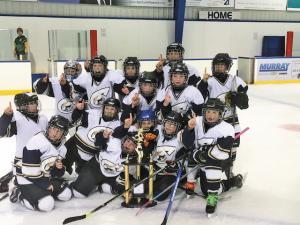 The Atom A Clippers celebrate their victory