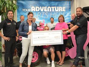 The Eastman ATV Association presents a cheque to Cancer Care Manitoba