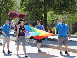 Michelle McHale and Chris Plett lead hundreds of marchers at the second annual Steinbach Pride parade