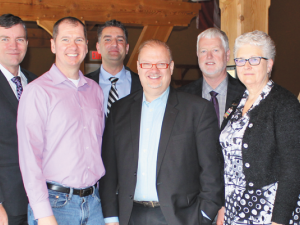 Gord Daman, Myron Dyck, Shannon Martin, Nathan Dueck, Kelvin Goertzen, Abe Bergen, Kathy McPhail, and Dr. Chris Burnett at Open Health facility tour