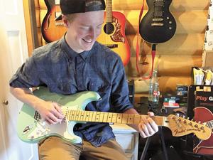 Justin Braun will be offering guitar lessons for a charitable cause