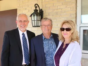 Dr. David Johnson alongside Herb and Erna Buller