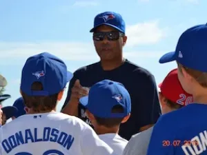 Former Blue Jay Roberto Alomar working with young players at this year's baseball camp