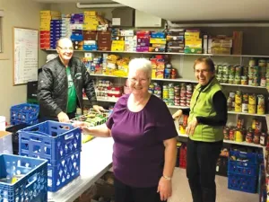 Helping Hands volunteers, Dale Toms, Mary Toms, and Irene Adams