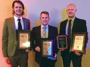 Marshall Douglas, Doug Dyck, and Justin Dyck accept their awards