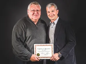 Ferd Klassen receiving certificate of appreciation at Fire/EMS appreciation night in May 2015