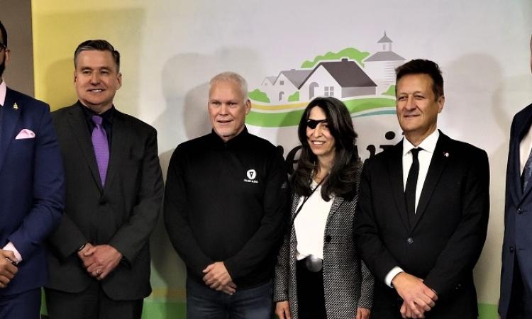 Obby Khan (Minister of Sport, Culture, and Heritage), Doyle Piwniuk (Minister of Transportation and Infrastructure), Michael Hamilton-Wright (Co-CEO, Volume Global), Juliette Hagopian (President, Julijette), Ron Schuler (MLA for Springfield-Ritchot), and Myron Dyck (Mayor of Niverville).