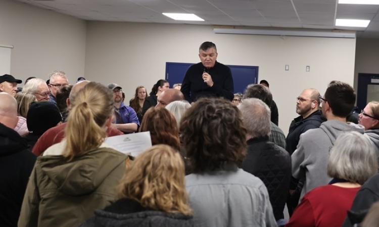Mayor Myron Dyck addresses the crowd at an open house at the CRRC in Niverville.