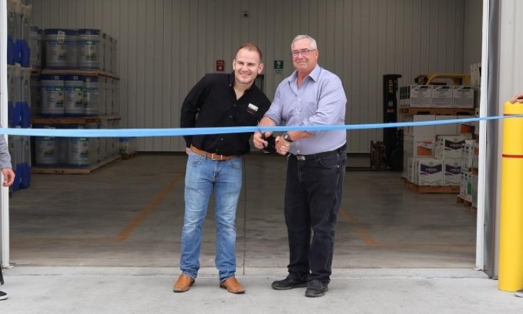 Mayor Chris Ewen cuts the ribbon with Terraco manager Marc Davy.
