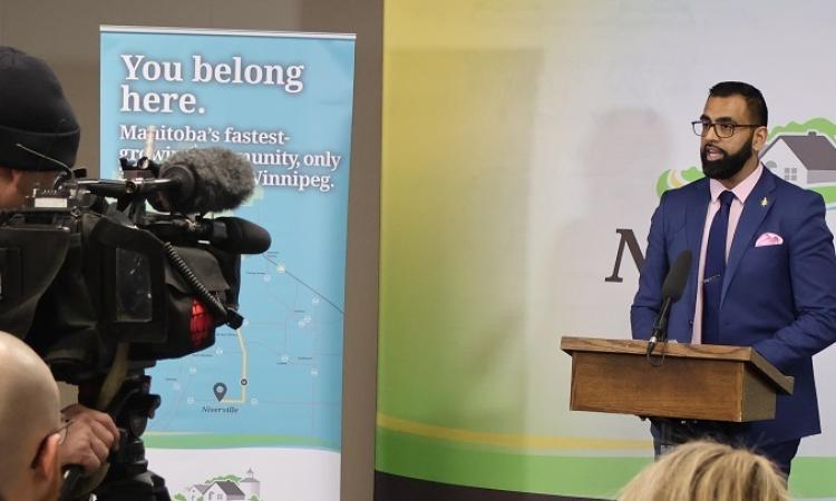 Obby Khan, Minister of Sport, Culture and Heritage, speaks at Niverville press conference.