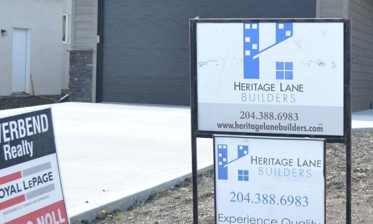 Both locally and acros the country, the real estate market is cooling down as interest rates heat up.