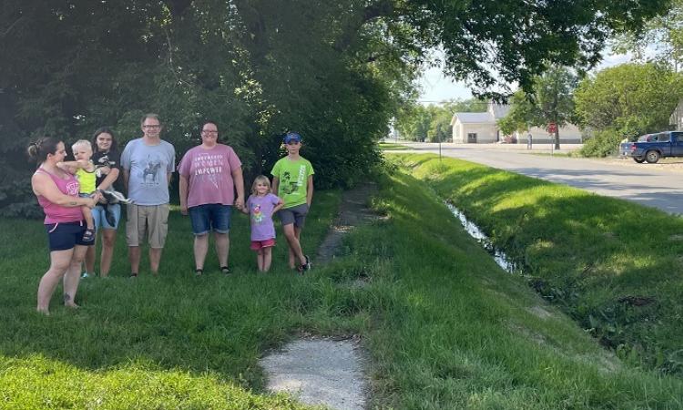 Families who live along First Street South are concerned about their street's impassable sidewalk.