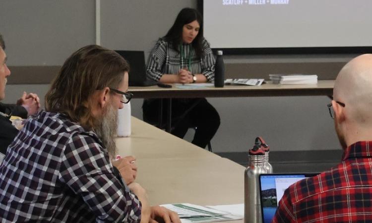 Engineers review options with gathered residents.