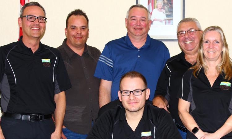 Curtis Claydon, Shane Pelletier, CAO Mitch Duval, Ron Mamchuk, and Janine Boulanger. Front: Mayor Chris Ewen.