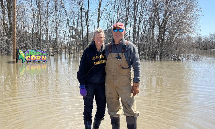 Angie and Clint Masse amidst floodwaters at their business, A Maze in Corn.