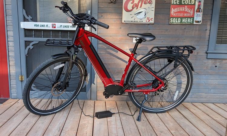 An e-bike attached to its charger.