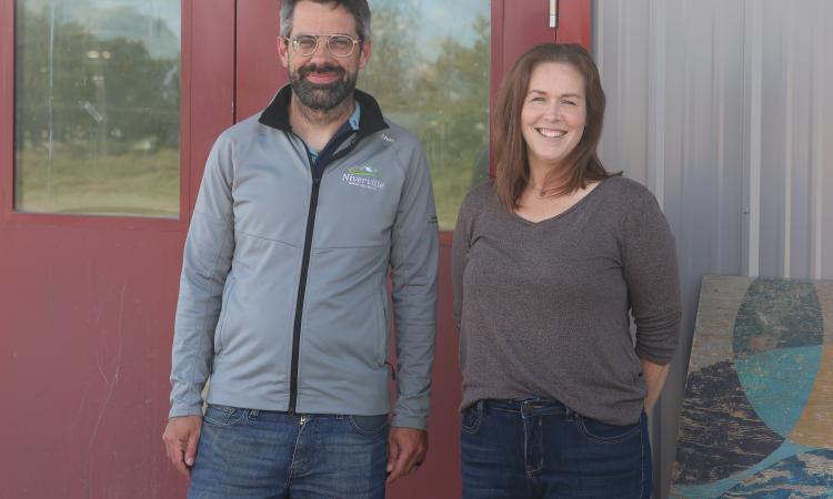 Warren Britton and Meghan Beasant at the Niverville Centennial Arena, where a new lending library will soon open.