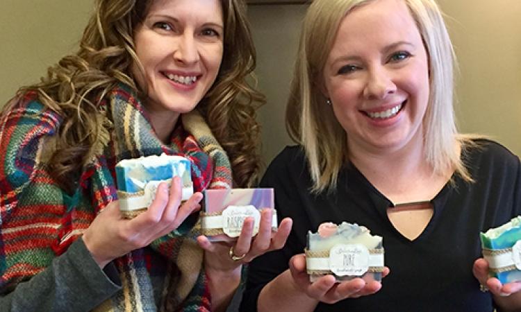 Ricki ten Hove and Amy Buhler show off their wares