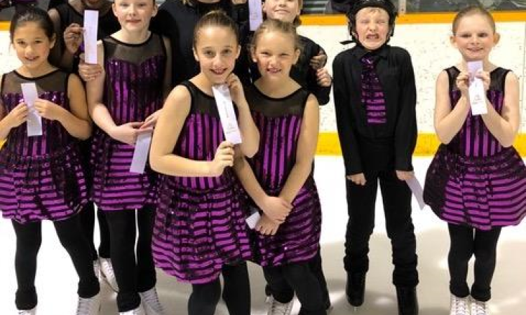 Niverville Skating Club’s synchro team, Aurora Ice, with their silver ribbons.