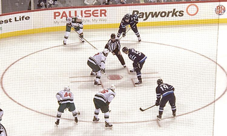 Mark Scheifele takes a face-off at the BellMTS Place.