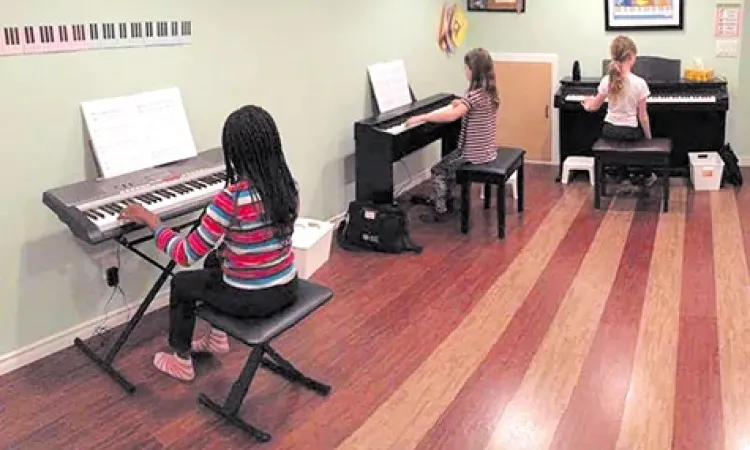 Children take part in Laura Visser's Music for Young Children program