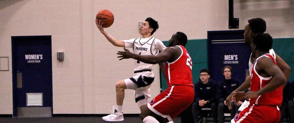 The men's basketball team on home turf at Niverville's CRRC.