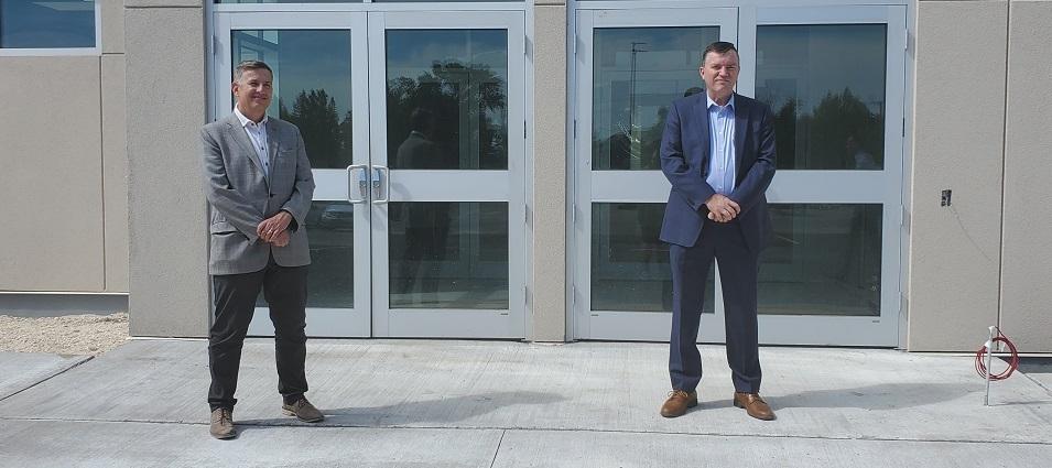 Dr. Kenton Anderson, President of Providence University, and Niverville Mayor Myron Dyck announce a partnership agreement for use of the CRRC fieldhouse.