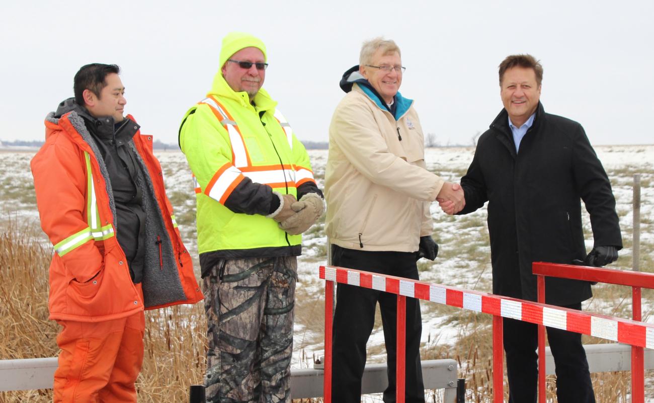 Last November, two provincial employees along with Deputy Mayor John Funk and MLA Ron Schuler meet outside Niverville.