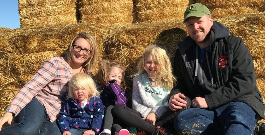 Garrett Hawgood with his wife Kate and three children.