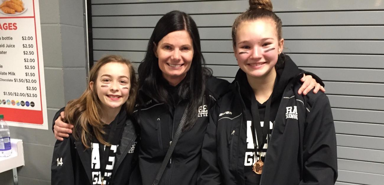 Carly Loeppky, Coach Mel Hall, and Brianna Ginter.