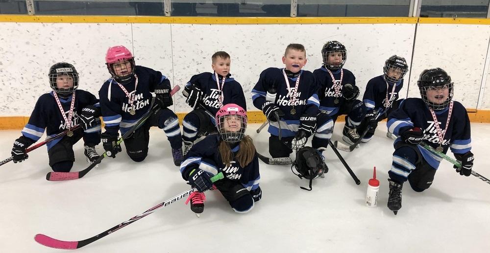 Landon Friesen, Mia Maloney, Brody Burke, Jacey Rae Dorcht, Zachary Boone, Sawyer Kroeker, Braylin Gray, and Asher Funk of the Clippers Initiation White team.