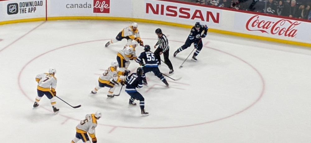 Scheifele takes a faceoff.