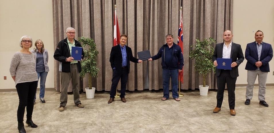 Marianne Porter, Yvette Bernat, Roger Perron, MLA Ron Schuler, Claude Lemoine, Ritchot Mayor Chris Ewen, and Councillor Shane Pelletier at the TC Energy Centre.